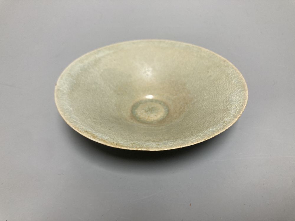 A Chinese Longquan celadon bowl, Song dynasty, 16cm, a conical celadon dish and a seal paste box base
